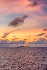 Fototapeta na wymiar The Oil and Gas Production Platform with the morning sky in Gulf of Thailand