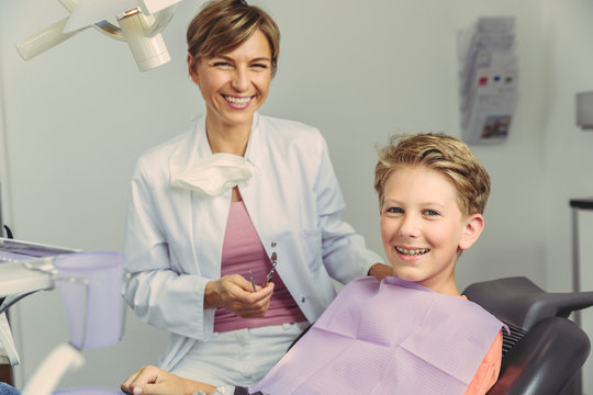 Boy Smiling Happily After Treatment At The Dentist