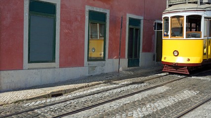 Naklejka na ściany i meble old historical tram in the city of lisbon