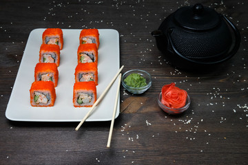 japanese rolls  served on plate on wood table