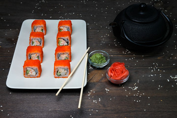 japanese rolls  served on plate on wood table
