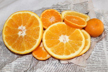 Mandarin and orange on Newspapers background orange juicy tasty vitamin healthy