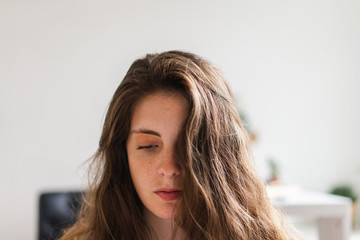 Portrait of brunette young woman at home