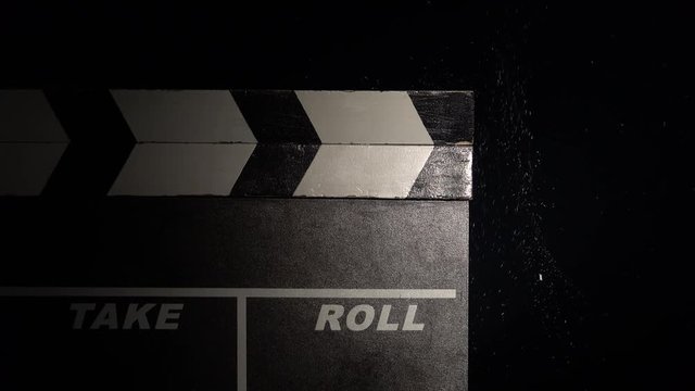 Clapper board close up. Black background