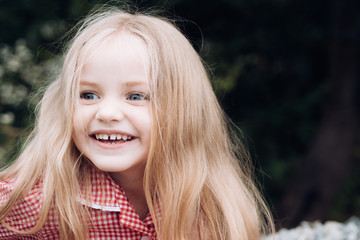 Fototapeta premium Perfect healthy hair. Little girl wear long hair. Small girl with blond hair. Happy little child with adorable smile. Small child happy smiling. Good laughs and Im happy