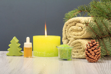 Fototapeta na wymiar Spa composition with towel, aromatic oil, soap, sea salt and candle