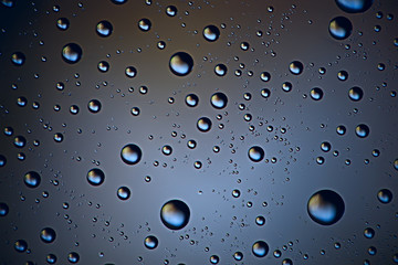 gray wet background / raindrops to overlay on the window, weather, background drops of water rain on the glass transparent