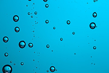 fresh drops background blue glass / wet rainy background, water drops transparent glass blue