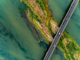 Aerial photography of long bridge top view crossing wide river