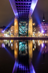 portrait shot The Tyne Bridge illuminated at night showing the Newcastle quayside