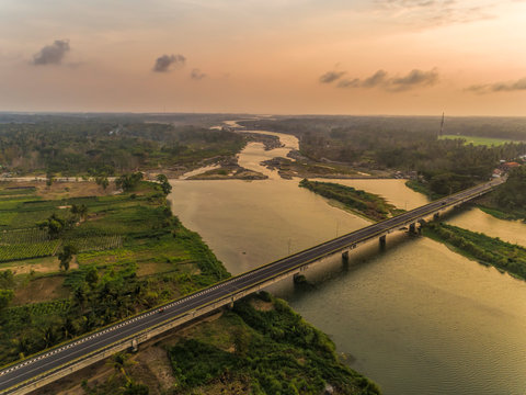Long Bridge sunset aerial shot with wide river and golden sky