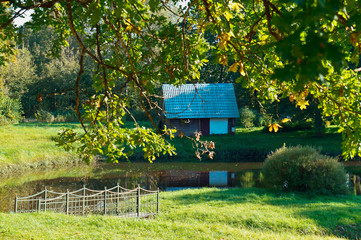 A lonely little cabin on the lake. The lake house in the woods.