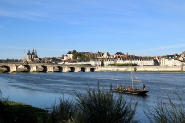 Fototapeta premium Jacques Gabriel bridge, Blois, Loire, chapel, St Nicholas Cathedral, river, boat, architecture, building, castle, old, cathedral, medieval, city, landmark, religion, historic, history, town,