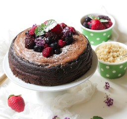 Homemade Chocolate Quinoa Cake topped with fruits and berries