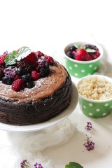 Homemade Chocolate Quinoa Cake topped with fruits and berries