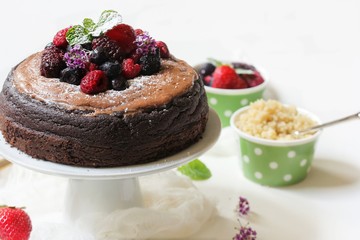 Homemade Chocolate Quinoa Cake topped with fruits and berries