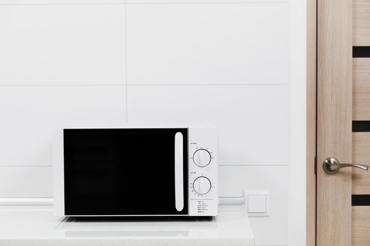 Modern kitchen interior with electric and microwave oven