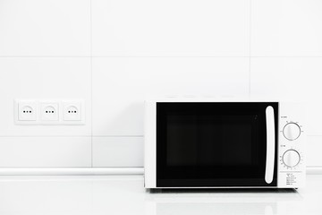 Image of the microwave oven. Modern microwave. Front view.