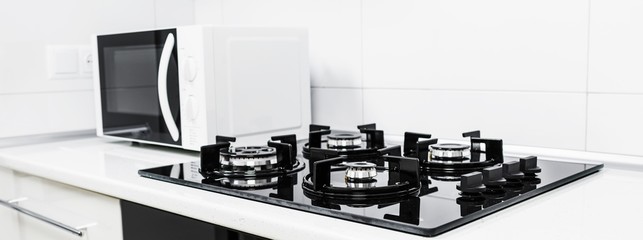 Modern kitchen interior with electric and microwave oven