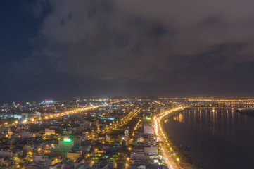 Night scenery of Da Nang city, Vietnam with the magic of light from the bridges, buildings and...
