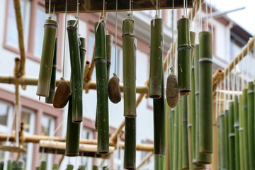 Obraz premium Green bamboo sticks. Green Bamboo tubes hang around the house.