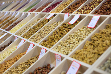 Various nuts and dried fruits on the market . Сoncept of healthy wholesome food, snack, diet