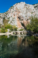 Fototapeta na wymiar Blagaj Tekke, Dervish House, in rocks at Buna river, Bosnia And Herzegovina