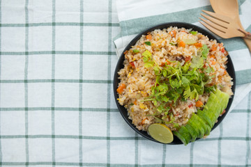 Fried rice with pork on black dish, Thai food