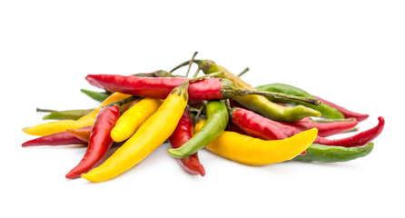 Pile of fresh small chilli peppers on white. Close up.