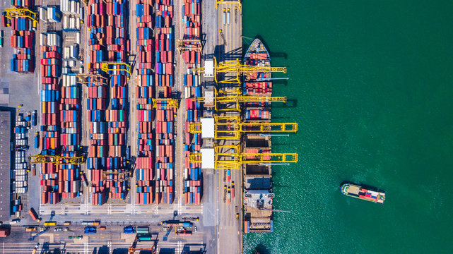 Aerial view of  Deep seaport with cargo ships and containers
