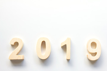 2019 Happy New Year with clock on white table background,Vintage tone,Copy space for your text.