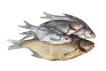 Smoked and dried fishes on white