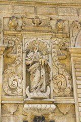 Sculpture of the figure of the Christian saint in the architecture of the old city