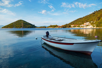 Naklejka na ściany i meble Boat at sea.Small town of Prozurska Luka on Mljet island.Croatia