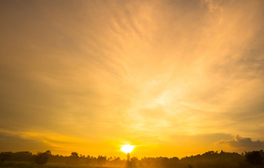Gold color sunset sky background with sun