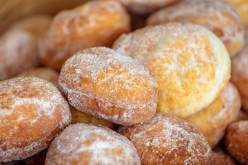 Homemade romanian doughnuts in a basket