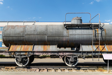 Fototapeta na wymiar old railway tank at the railway depot