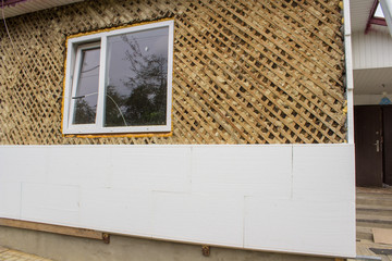 Insulation of house with styrofoam,Thermo insulation on a wooden house