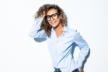 Latin curly mixed race business woman in glasses smiling looking at camera in office isolated on white background