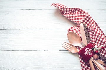 Fototapeta premium Christmas dinner cutlery on a white wooden background