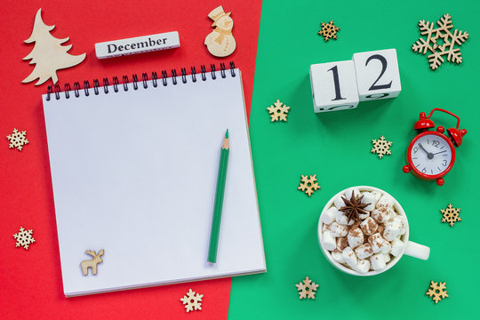 calendar December 12th cup cocoa and marshmallow, empty open notepad