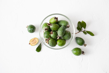 Fresh raw feijoa fruit in a plate on white