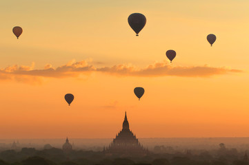 Hot air balloon over plain of Bagan in misty morning, Myanmar.