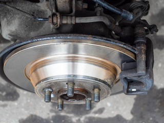 top view of new brake disc on old car