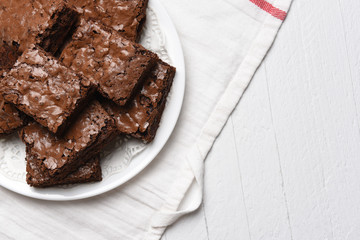 Flat lay view of a plate of fresh homemade brownies