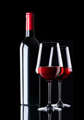red wine bottle an two glasses of red wine