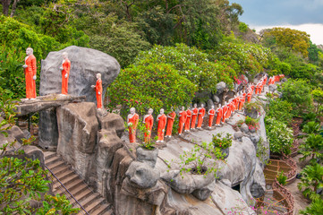 Procession of sculptured Buddhist monks Dambulla Caves Cultural Triangle Sri Lanka. - 231210882