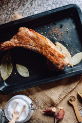 raw meat on in a metal box on dark background