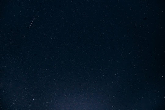 Night Starry Sky. Glowing Stars And Meteoric Tracks Trail In Dar