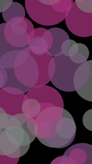 Multicolored translucent circles on a dark background. Vertical image orientation. 3D illustration